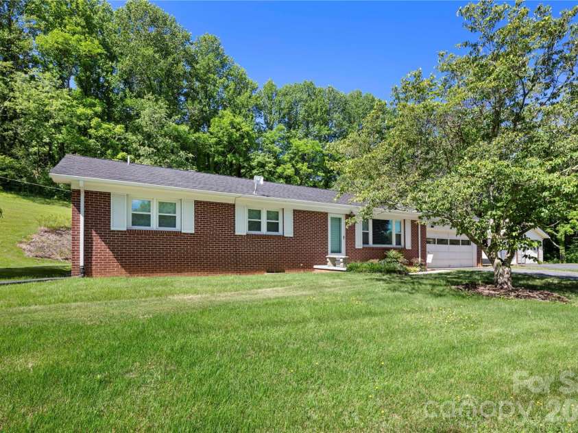 83 Honeysuckle Lane, Burnsville, NC 28714.  MLS# CAR4377930, YatesRealty ID 27630. 2 BR, 2 BA home on 2.05 acres with attached garage and detached 2 car garage / workshop