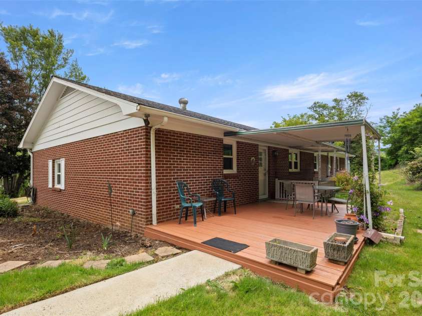 83 Honeysuckle Lane, Burnsville, NC 28714.  MLS# CAR4377930, YatesRealty ID 27630. Back patio