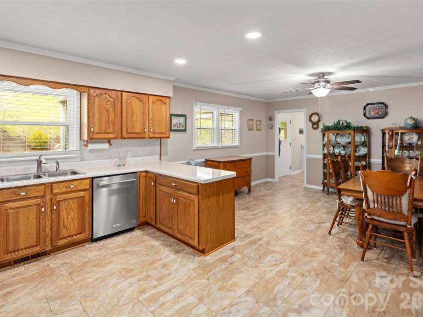 83 Honeysuckle Lane, Burnsville, NC 28714.  MLS# CAR4377930, YatesRealty ID 27630. Eat in kitchen with spacious dining area