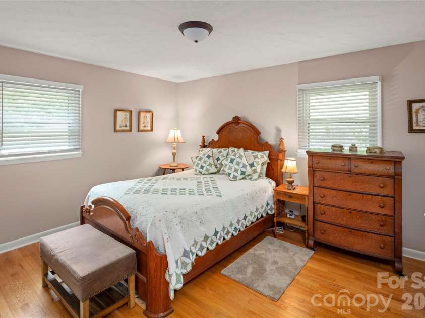 83 Honeysuckle Lane, Burnsville, NC 28714.  MLS# CAR4377930, YatesRealty ID 27630. Primary bedroom with expanded, updated bathroom