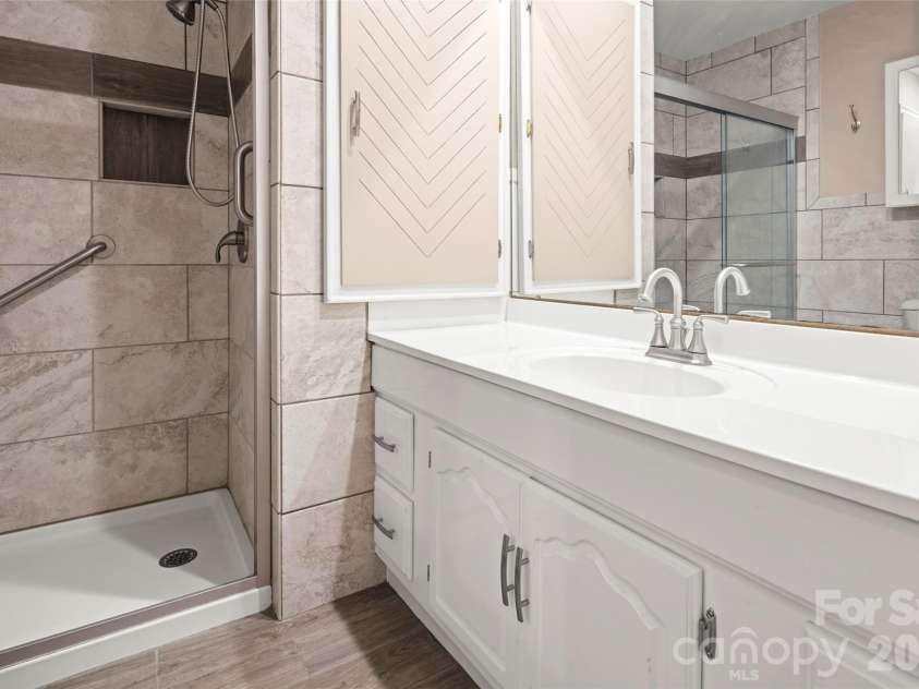 83 Honeysuckle Lane, Burnsville, NC 28714.  MLS# CAR4377930, YatesRealty ID 27630. Updated second bathroom with walk in shower