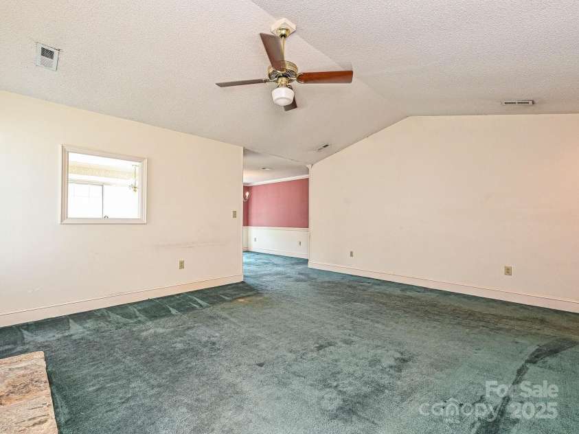 2912 Peachwood Court, Fort Mill, SC 29715.  MLS# CAR4276302, YatesRealty ID 27631. Living Room Leading to Formal Dining