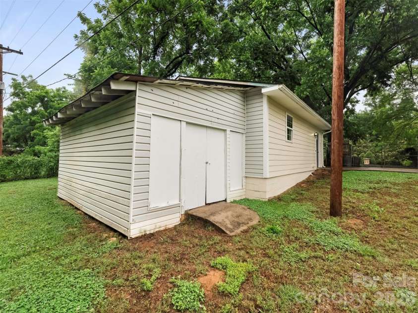 1016 Underwood Road, Matthews, NC 28104.  MLS# CAR4379507, YatesRealty ID 27632. Storage behind Garage/Laundry Area