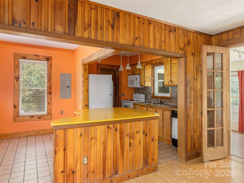 304 Old Haw Creek Road, Asheville, NC 28805.  MLS# CAR4275687, YatesRealty ID 27634. Kitchen with Center Island