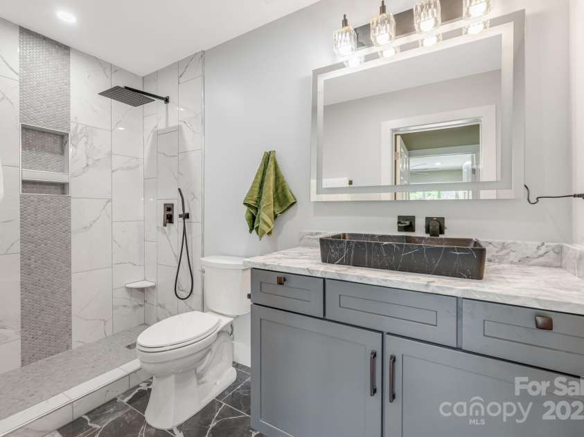 115 Nader Avenue, Weaverville, NC 28787.  MLS# CAR4282051, YatesRealty ID 27638. DOWNSTAIRS BATHROOM
