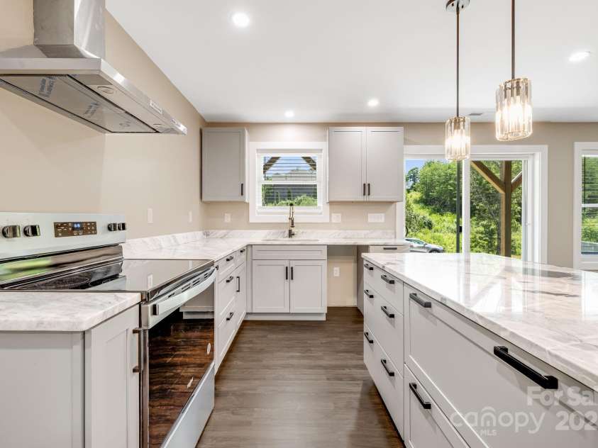 115 Nader Avenue, Weaverville, NC 28787.  MLS# CAR4282051, YatesRealty ID 27638. DOWNSTAIRS KITCHEN