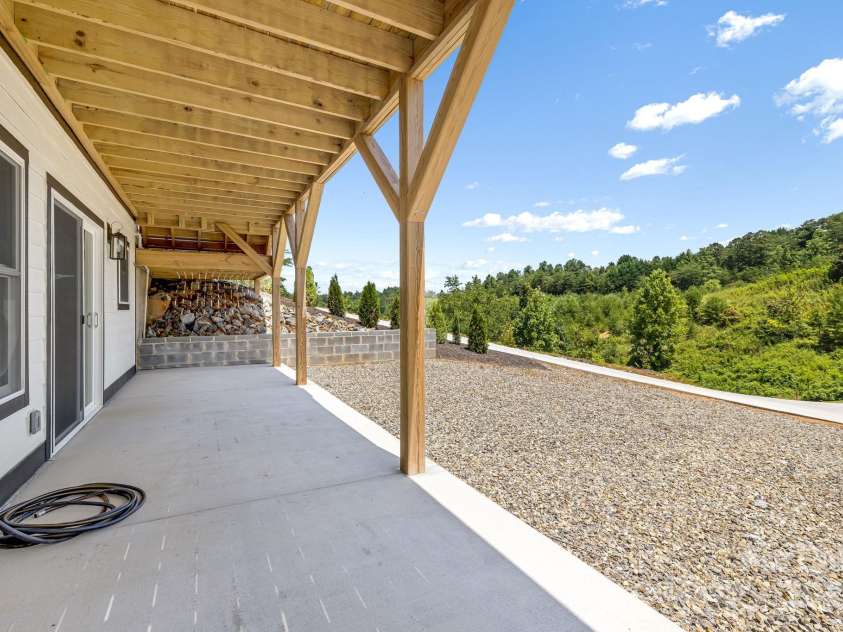 115 Nader Avenue, Weaverville, NC 28787.  MLS# CAR4282051, YatesRealty ID 27638. DOWNSTAIRS PATIO