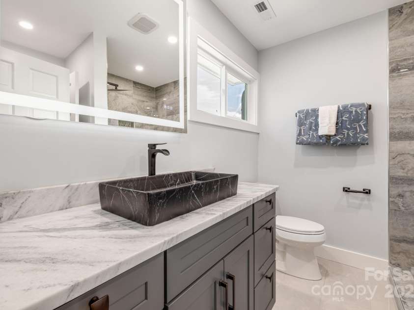 115 Nader Avenue, Weaverville, NC 28787.  MLS# CAR4282051, YatesRealty ID 27638. JACK AND JILL BATHROOM