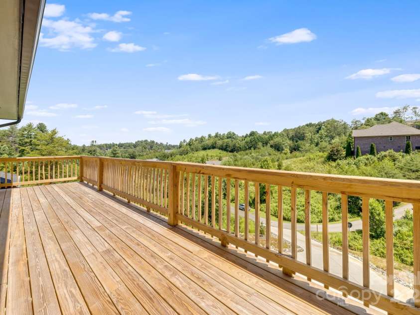 115 Nader Avenue, Weaverville, NC 28787.  MLS# CAR4282051, YatesRealty ID 27638. UPSTAIRS DECK OFF MAIN BEDROOM