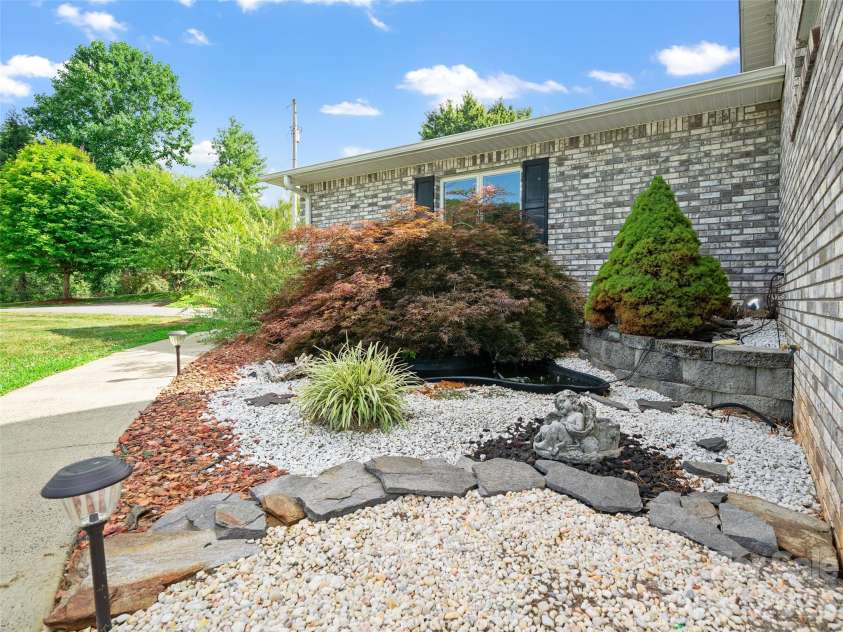 124 Dogwood Circle, Burnsville, NC 28714.  MLS# CAR4290145, YatesRealty ID 2764. Pond on front of home 