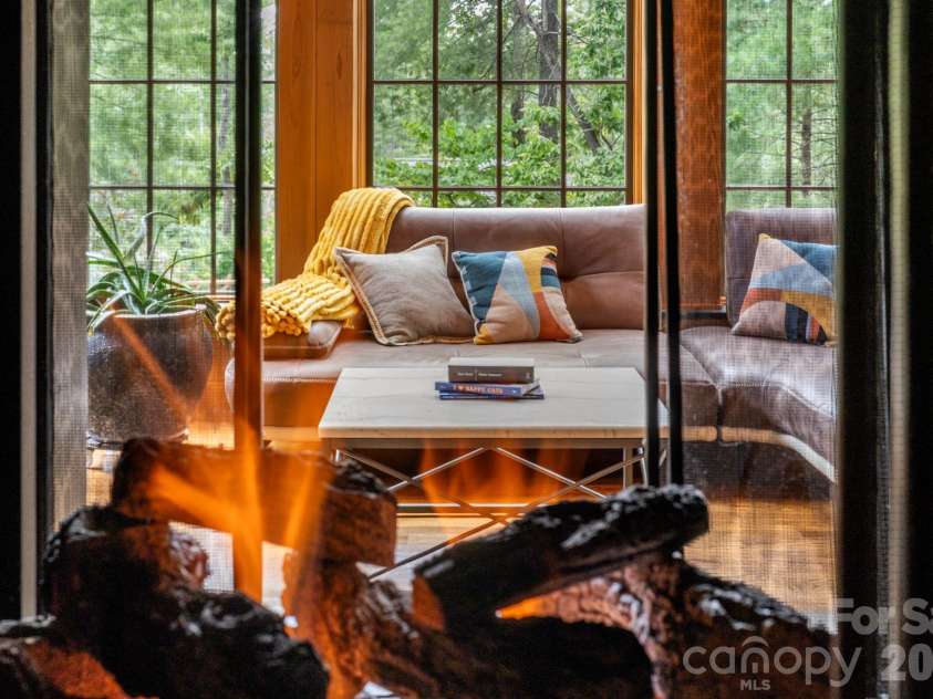 85 Chauncey Circle, Asheville, NC 28803.  MLS# CAR4378416, YatesRealty ID 27640. A dramatic see-through stone fireplace.