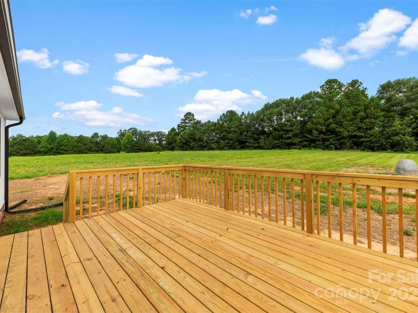 6788 Clyde Wehunt Road, Cherryville, NC 28021.  MLS# CAR4283627, YatesRealty ID 27642. Back deck