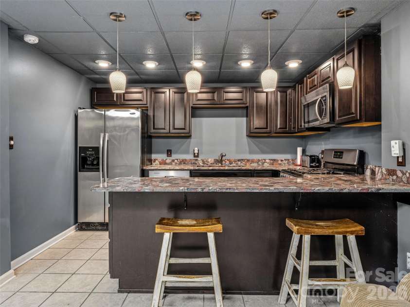 243 Poplar Lane, Pisgah Forest, NC 28712.  MLS# CAR4386955, YatesRealty ID 27648. Basement full kitchen