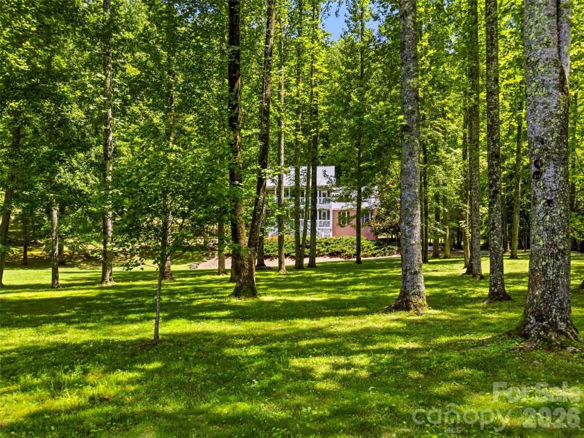 243 Poplar Lane, Pisgah Forest, NC 28712.  MLS# CAR4386955, YatesRealty ID 27648. Beautiful wooded setting