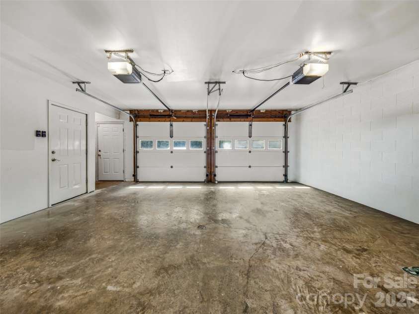 243 Poplar Lane, Pisgah Forest, NC 28712.  MLS# CAR4386955, YatesRealty ID 27648. Large garage in basement