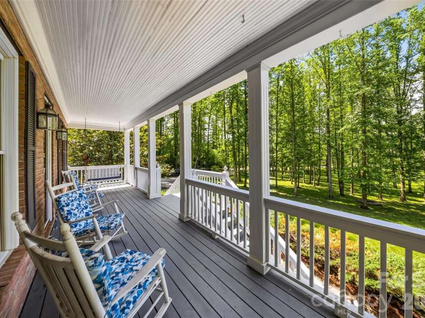 243 Poplar Lane, Pisgah Forest, NC 28712.  MLS# CAR4386955, YatesRealty ID 27648. Main level front porch over looks fire pit and grounds