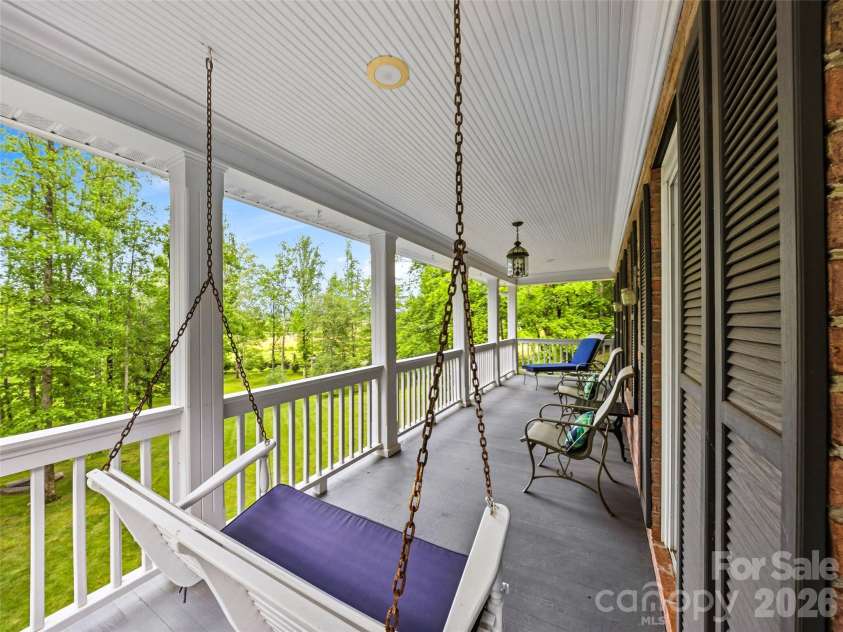243 Poplar Lane, Pisgah Forest, NC 28712.  MLS# CAR4386955, YatesRealty ID 27648. Upper level porch