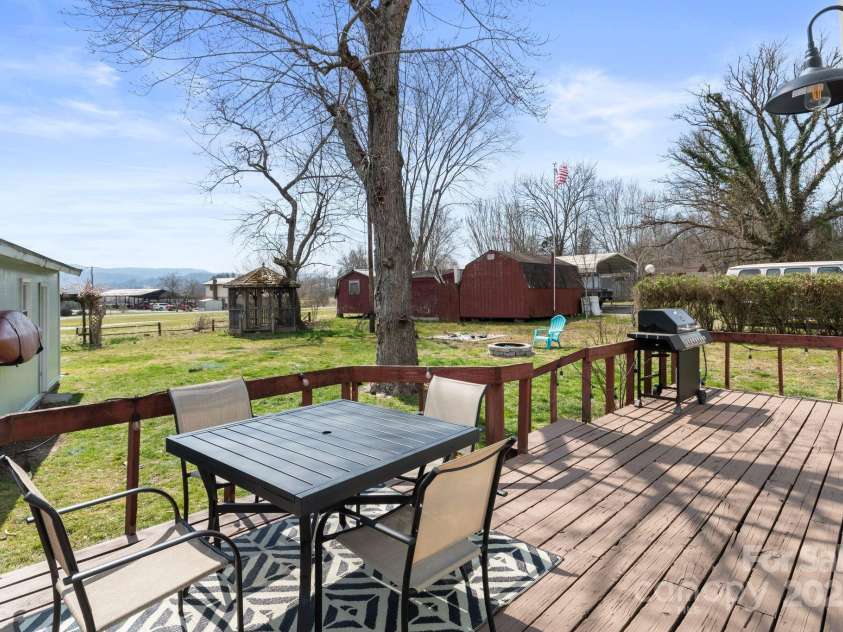 452 Old Hendersonville Highway, Brevard, NC 28712.  MLS# CAR4226407, YatesRealty ID 27652. Back deck is perfect for relaxing, entertaining, or simply enjoying the outdoors