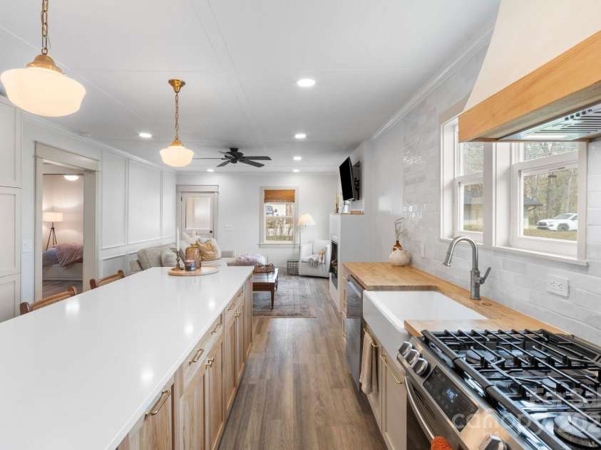 452 Old Hendersonville Highway, Brevard, NC 28712.  MLS# CAR4226407, YatesRealty ID 27652. Large basin sink and high-performance natural gas range for all your cooking needs