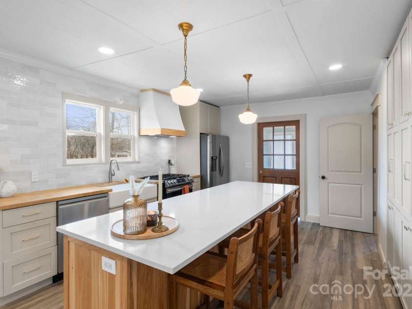 452 Old Hendersonville Highway, Brevard, NC 28712.  MLS# CAR4226407, YatesRealty ID 27652. This kitchen is truly the heart of the home