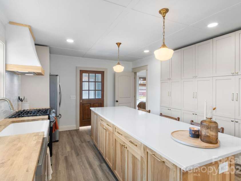 452 Old Hendersonville Highway, Brevard, NC 28712.  MLS# CAR4226407, YatesRealty ID 27652. Updated vinyl plank flooring seamlessly flows throughout the home