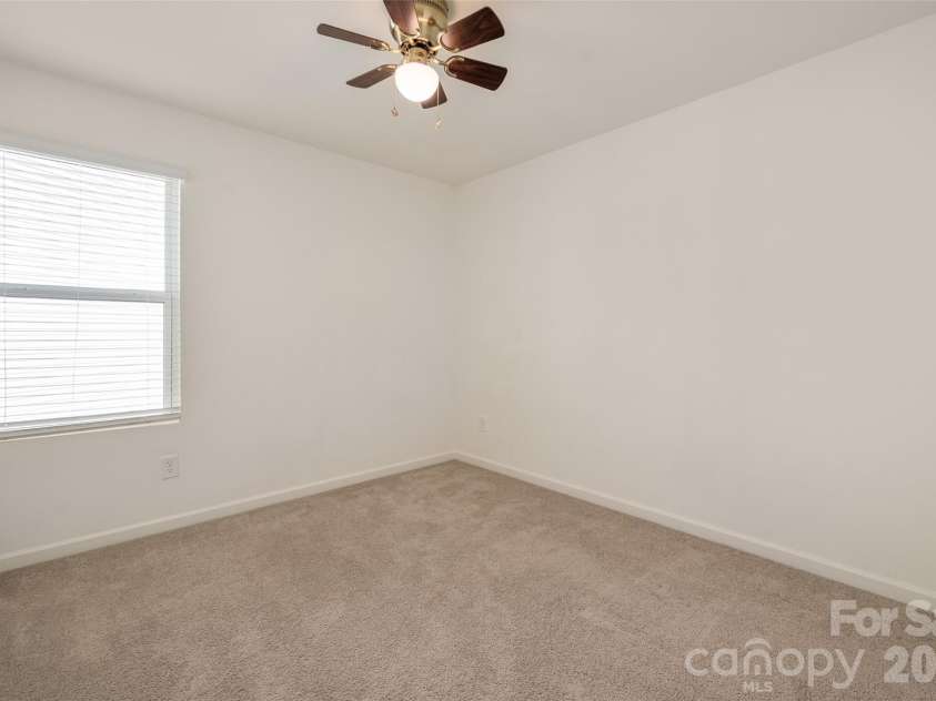 13205 Gadwal Pintail Drive, Charlotte, NC 28262.  MLS# CAR4380012, YatesRealty ID 27656. Bedroom 2 with ceiling fan.