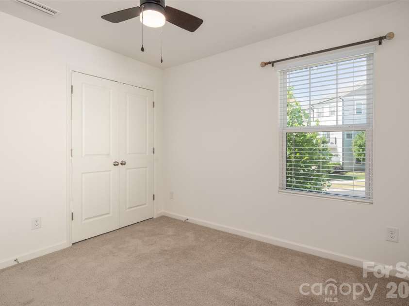 13205 Gadwal Pintail Drive, Charlotte, NC 28262.  MLS# CAR4380012, YatesRealty ID 27656. Bedroom 3 with ceiling fan.
