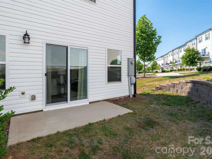 13205 Gadwal Pintail Drive, Charlotte, NC 28262.  MLS# CAR4380012, YatesRealty ID 27656. Step through the sliding door (with screen) onto the patio for a barbecue or morning coffee.