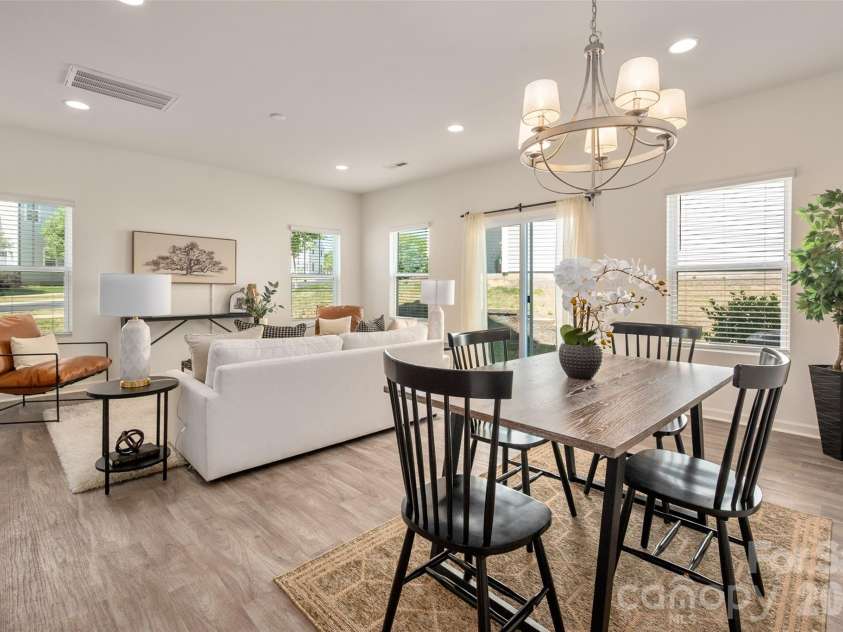 13205 Gadwal Pintail Drive, Charlotte, NC 28262.  MLS# CAR4380012, YatesRealty ID 27656. The open-concept floor plan features a dining area that flows seamlessly into the living room.