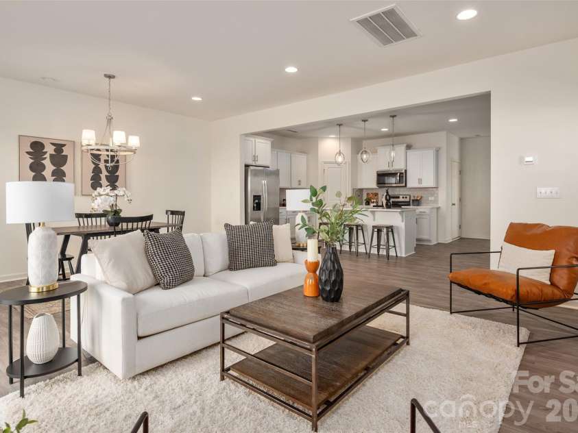 13205 Gadwal Pintail Drive, Charlotte, NC 28262.  MLS# CAR4380012, YatesRealty ID 27656. There is just enough separation between the kitchen and the living room/dining area.