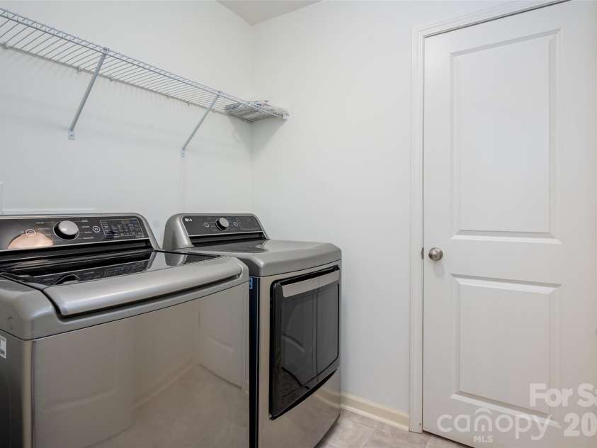 13205 Gadwal Pintail Drive, Charlotte, NC 28262.  MLS# CAR4380012, YatesRealty ID 27656. Upper level laundry room.