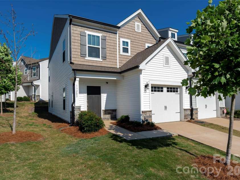 13205 Gadwal Pintail Drive, Charlotte, NC 28262.  MLS# CAR4380012, YatesRealty ID 27656. Welcome Home!  This end-unit townhome is the largest floorplan in the Villages at Mallard Creek - a RARE opportunity!
