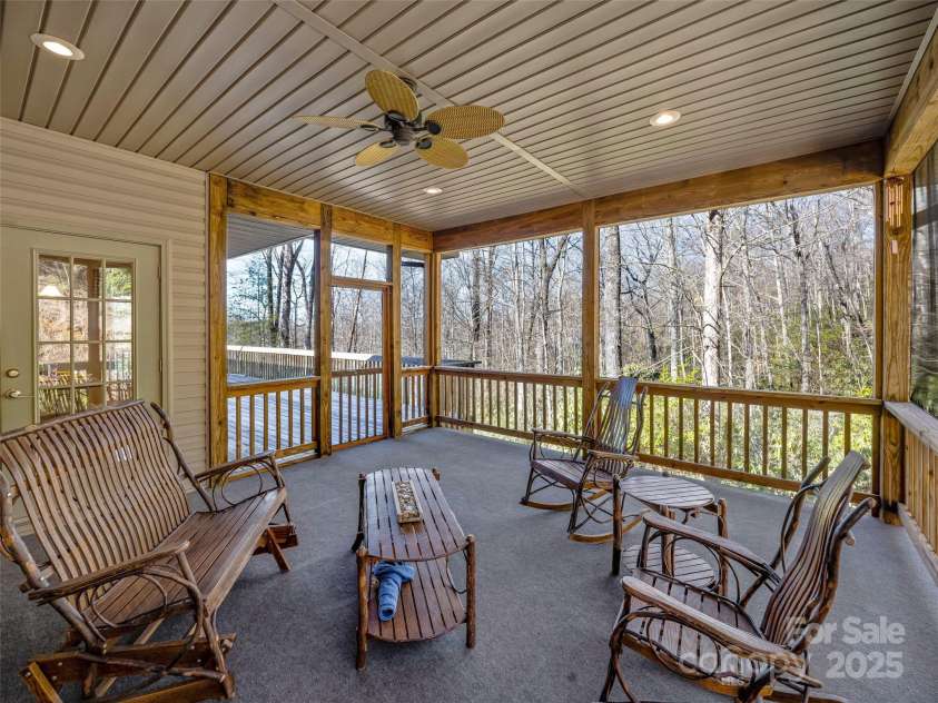 872 Aberdeen Lane, Pisgah Forest, NC 28768.  MLS# CAR4231636, YatesRealty ID 27659. Looking into woods from screened porth