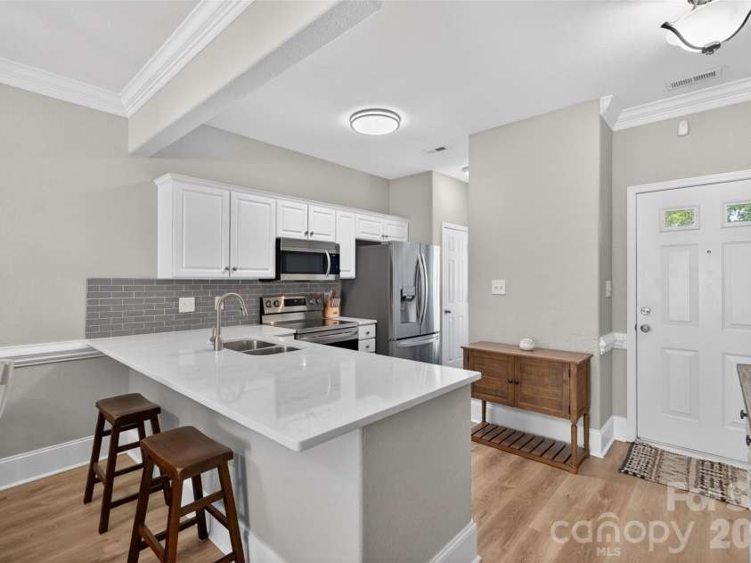 4071 Center Place Drive, Harrisburg, NC 28075.  MLS# CAR4380893, YatesRealty ID 27667. Foyer and Kitchen area.