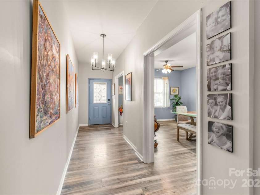 3215 Roan Street, Concord, NC 28027.  MLS# CAR4328709, YatesRealty ID 2767. A large dining area to your left as you enter is spacious enough for entertaining all your friends 