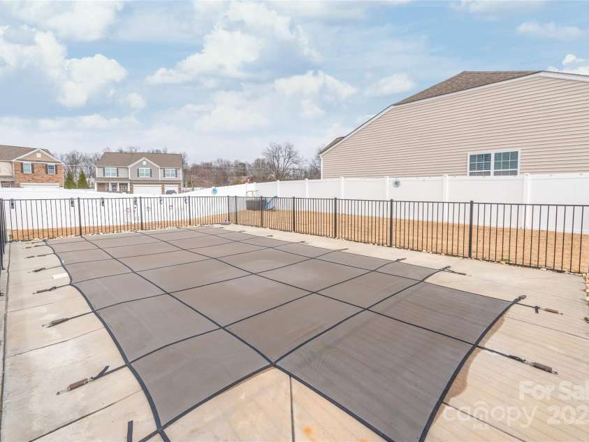 3215 Roan Street, Concord, NC 28027.  MLS# CAR4328709, YatesRealty ID 2767. It may be chilly outside now, but SUMMER is on its way, and you can be ready to enjoy it with your private pool