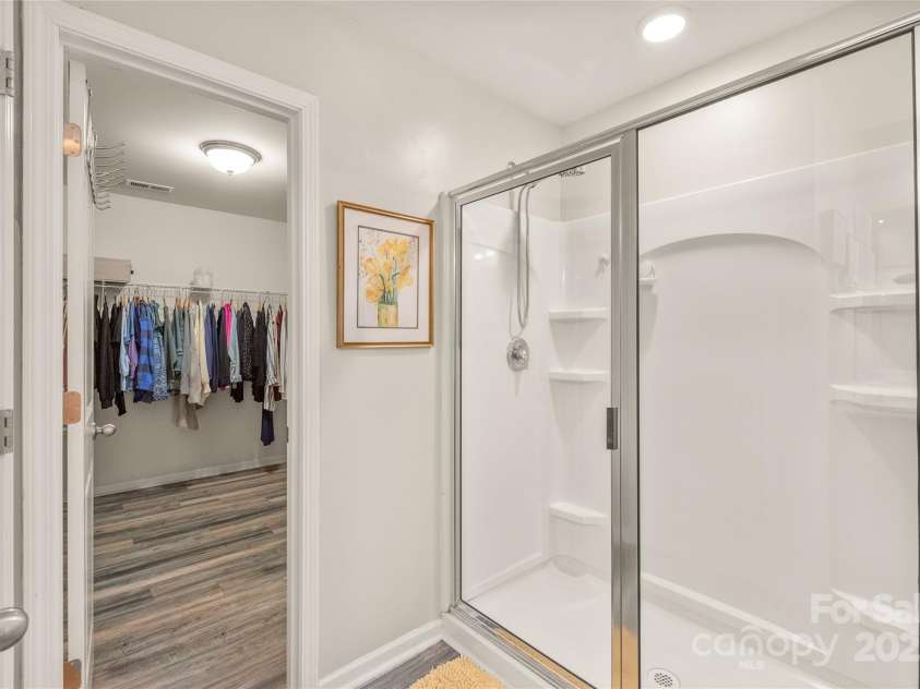3215 Roan Street, Concord, NC 28027.  MLS# CAR4328709, YatesRealty ID 2767. Large walk in shower with entrance to your spacious closet