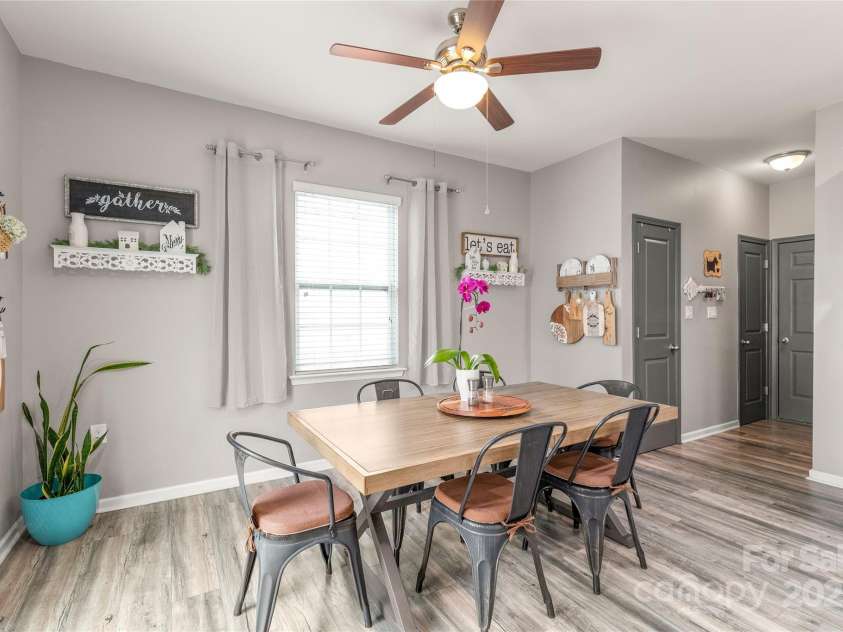 3215 Roan Street, Concord, NC 28027.  MLS# CAR4328709, YatesRealty ID 2767. Room enough for all. The breakfast area leads to the pantry, laundry, and garage entrance.