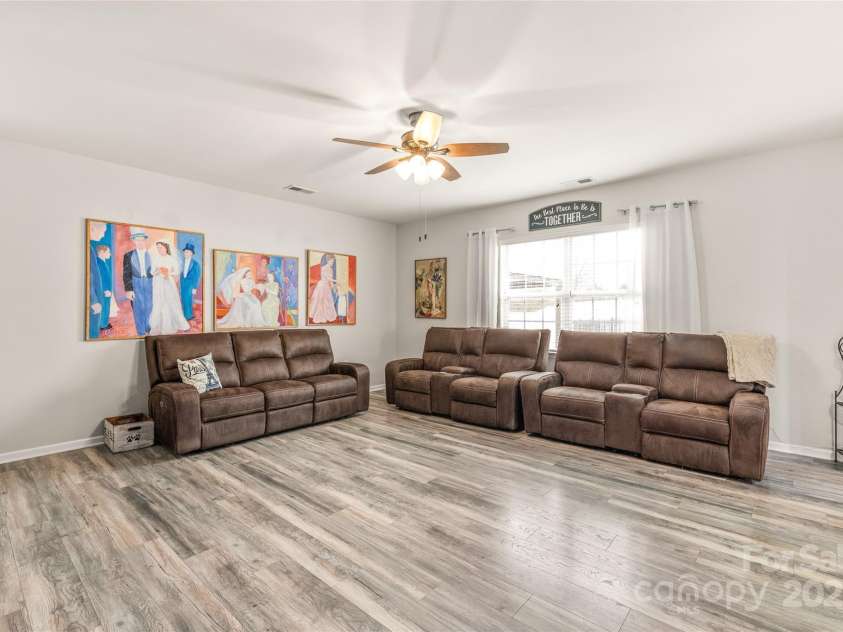 3215 Roan Street, Concord, NC 28027.  MLS# CAR4328709, YatesRealty ID 2767. The large living room is open to the heart of this home.