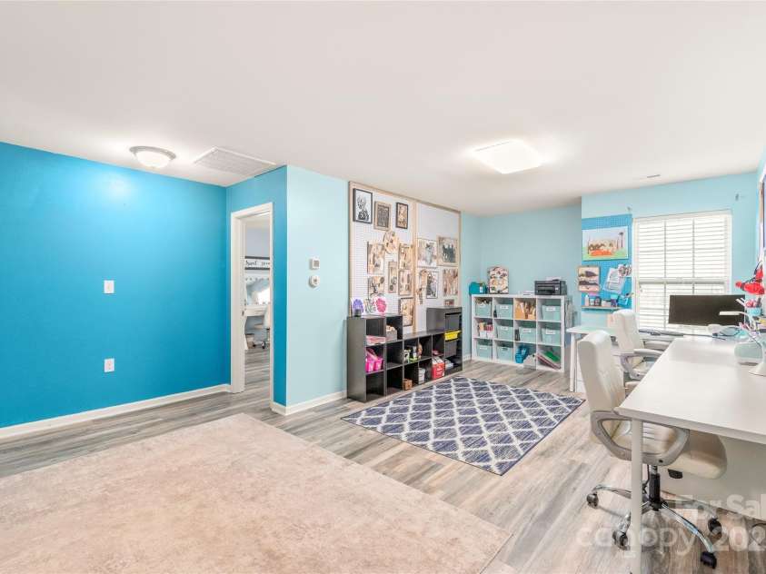 3215 Roan Street, Concord, NC 28027.  MLS# CAR4328709, YatesRealty ID 2767. The oversized loft area upstairs offers numerous options. What ideas would you have for this space?