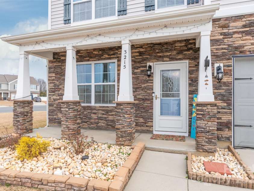 3215 Roan Street, Concord, NC 28027.  MLS# CAR4328709, YatesRealty ID 2767. Welcome your friends from the covered front porch