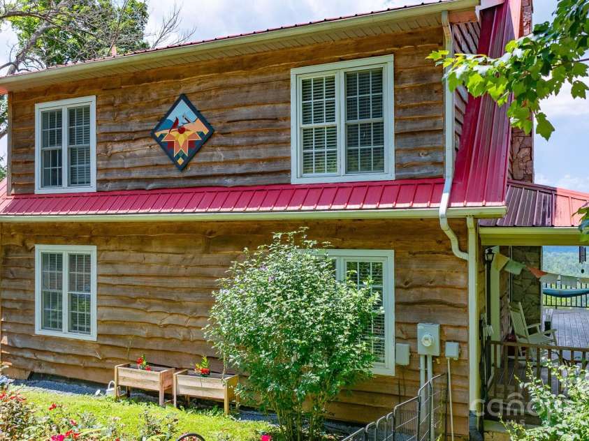 715 Sunset Mountain Road, Bakersville, NC 28705.  MLS# CAR4276207, YatesRealty ID 27672. Carolina Hemlock siding graces the exterior.