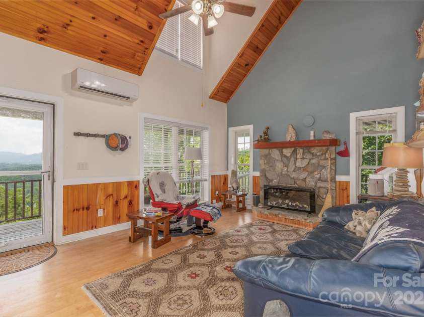 715 Sunset Mountain Road, Bakersville, NC 28705.  MLS# CAR4276207, YatesRealty ID 27672. Den and view from front door.