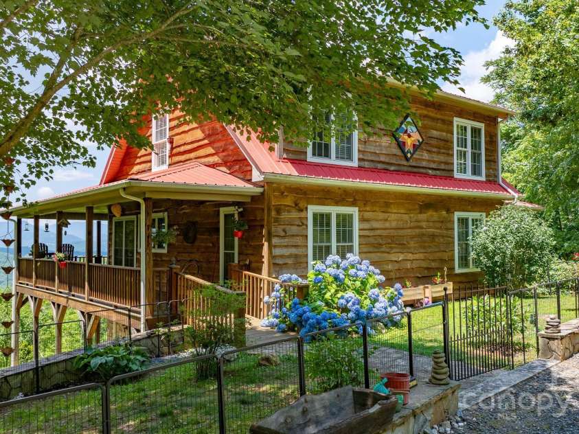 715 Sunset Mountain Road, Bakersville, NC 28705.  MLS# CAR4276207, YatesRealty ID 27672. Easy entry from circular drive into your mountain oasis.