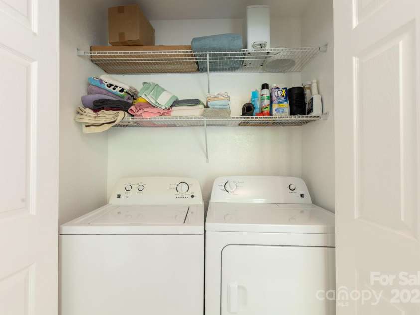 715 Sunset Mountain Road, Bakersville, NC 28705.  MLS# CAR4276207, YatesRealty ID 27672. Laundry in closet of primary bath on main level.