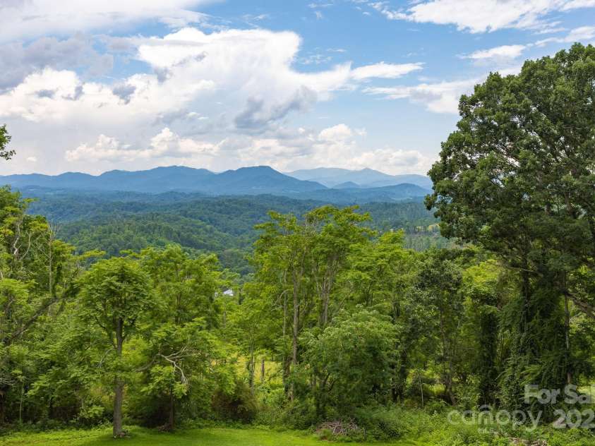 715 Sunset Mountain Road, Bakersville, NC 28705.  MLS# CAR4276207, YatesRealty ID 27672. Long range mountain views.