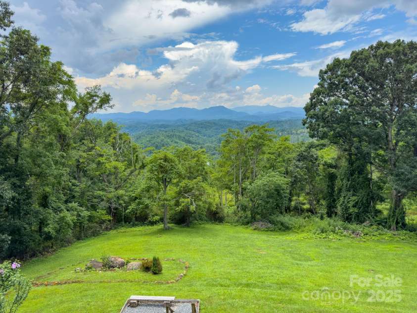 715 Sunset Mountain Road, Bakersville, NC 28705.  MLS# CAR4276207, YatesRealty ID 27672. Lower yard