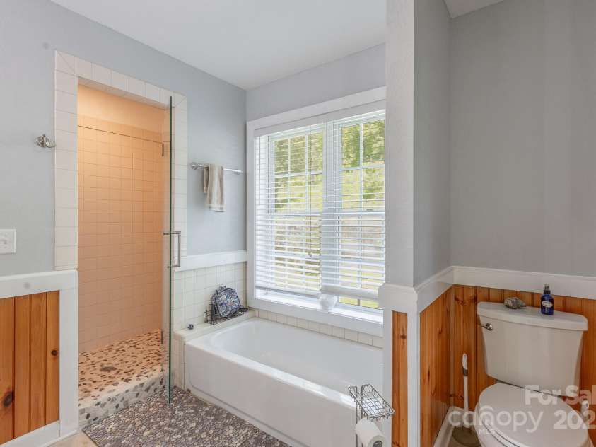 715 Sunset Mountain Road, Bakersville, NC 28705.  MLS# CAR4276207, YatesRealty ID 27672. Primary bath garden tub & walk in shower.