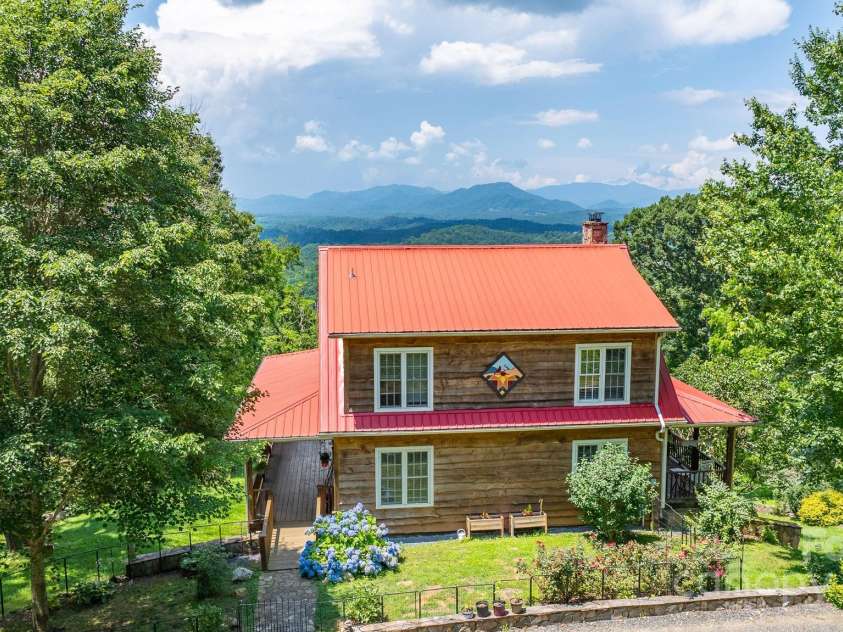 715 Sunset Mountain Road, Bakersville, NC 28705.  MLS# CAR4276207, YatesRealty ID 27672. Rear of home showing long range mountain views.