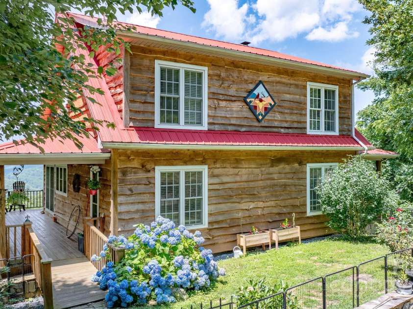 715 Sunset Mountain Road, Bakersville, NC 28705.  MLS# CAR4276207, YatesRealty ID 27672. Rear view of home at driveway.